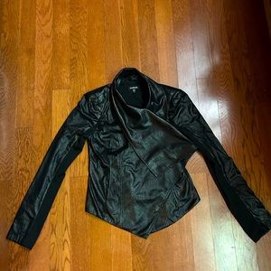 Bebe black vegan leather jacket. Criss cross style closure. EUC